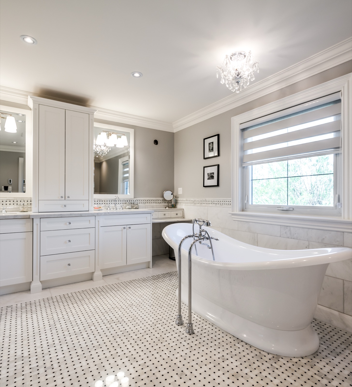 Spa bathroom with freestanding slipper tub and crystal chandelier