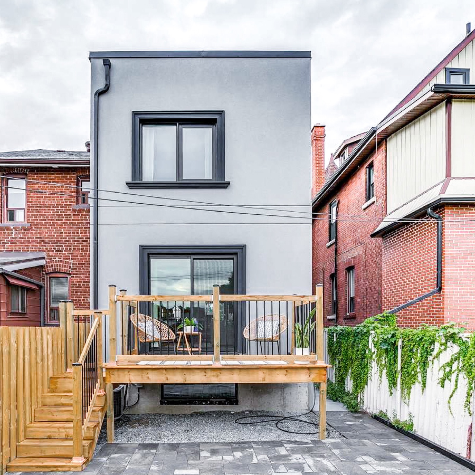 Modern grey rear addition with cedar deck