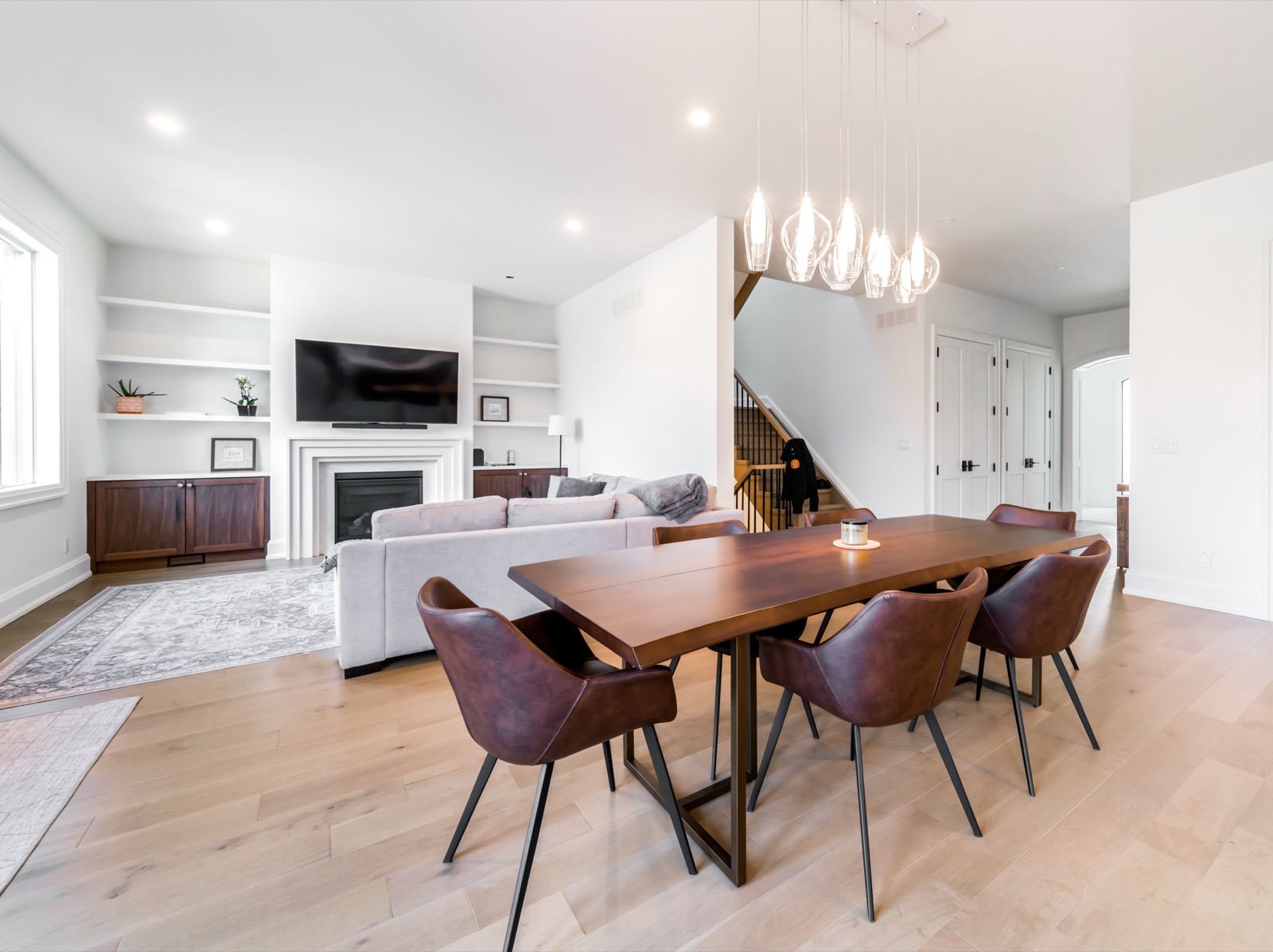 Open-concept living and dining space with live-edge table